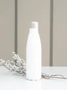 white bottle on white table